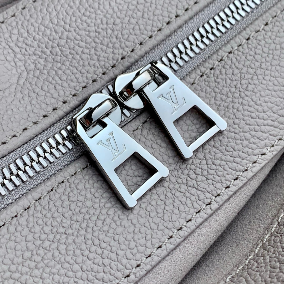 ONTHEGO EAST WEST BAG 25 IN BICOLOR MONOGRAM EMPREINTE LEATHER