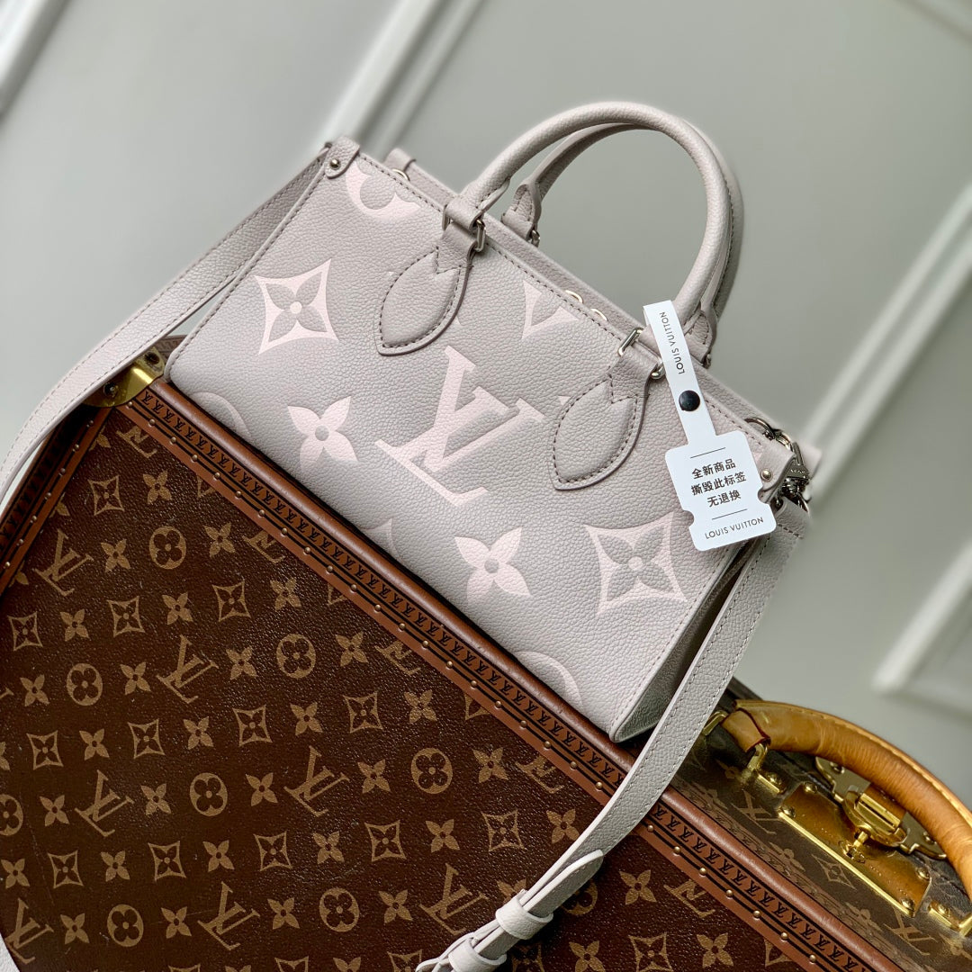 ONTHEGO EAST WEST BAG 25 IN BICOLOR MONOGRAM EMPREINTE LEATHER