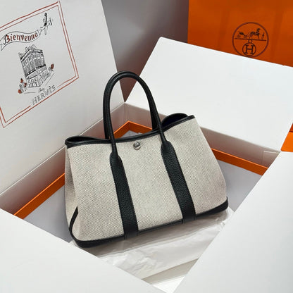 GARDEN PARTY 30CM IN WHITE TOILETS COTTON CANVAS AND BLACK CALFSKIN BLUE CANVAS ON SIDE OTHER