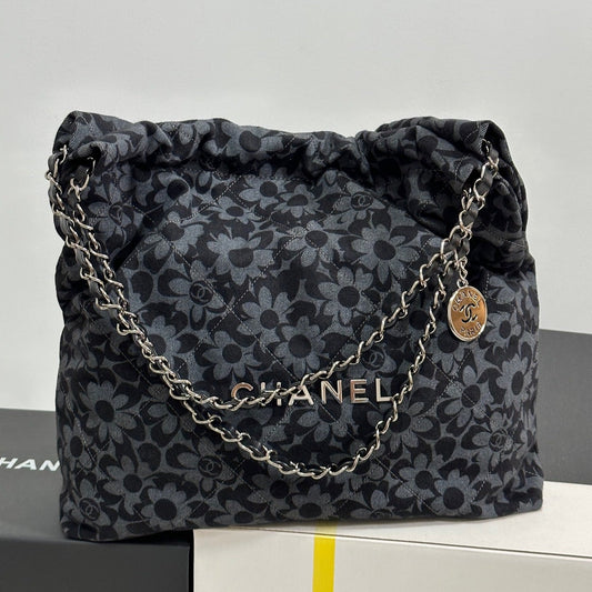 LARGE DRAWSTRING FLORAL PRINT SHOULDER BAG 39 IN BLACK MIX GREY DENIM